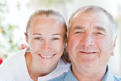smiling woman with smiling old man