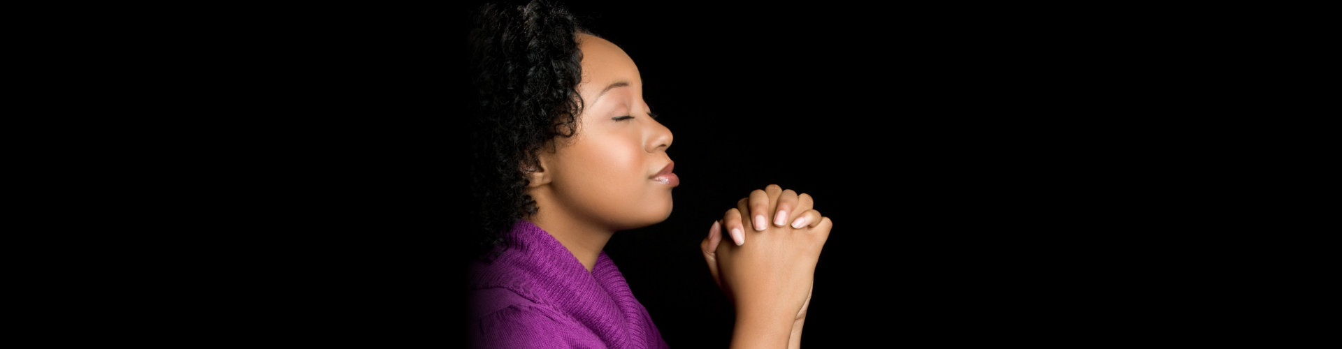Pretty religious black woman praying